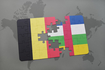 puzzle with the national flag of belgium and central african republic on a world map background.