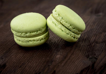 green cake macaron on wood background, maccarone sweet dessert