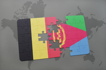 puzzle with the national flag of belgium and eritrea on a world map background.