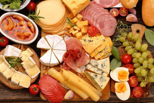 buffet of various types of cheese and appetizers set