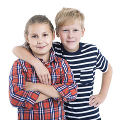 An eight age two children standing and embracing together, isolated white background