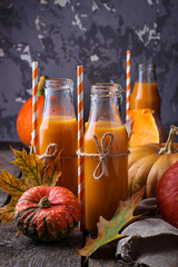 Bottles of healthy pumpkin juice