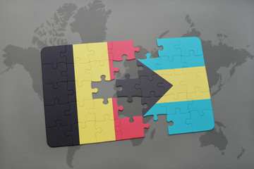 puzzle with the national flag of belgium and bahamas on a world map background.
