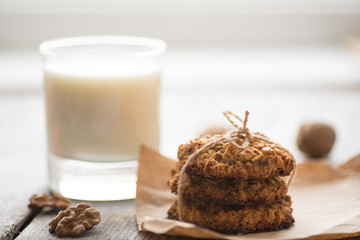 Homemade oatmeal cookies served with cup of milk