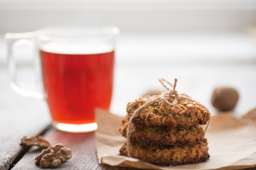 Homemade oatmeal cookies served with cup of tea
