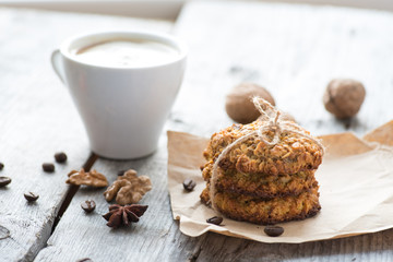 Homemade oatmeal cookies served with cup of coffee