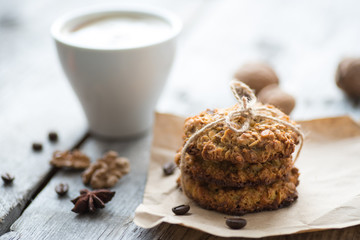 Homemade oatmeal cookie served with cup of coffee
