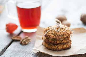 Homemade oatmeal cookie served with cup of tea