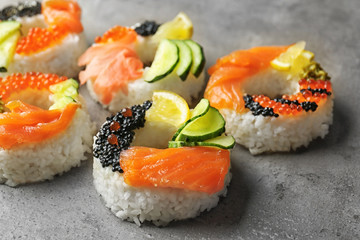 Sushi doughnuts on grey textured background