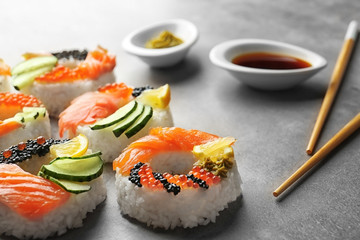 Sushi doughnuts on grey textured background