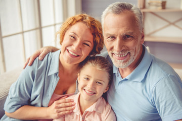 Grandparents and little girl at home