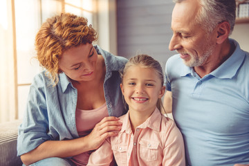 Grandparents and little girl at home