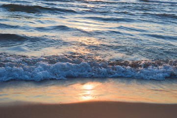 Brilliant sunrise over the waters of lake Huron in Oscoda, Michigan
