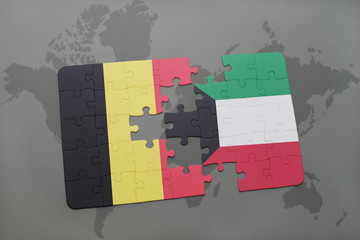 puzzle with the national flag of belgium and kuwait on a world map background.