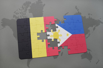 puzzle with the national flag of belgium and philippines on a world map background.