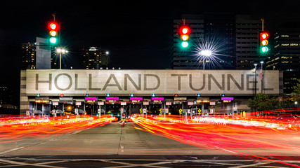 Holland Tunnel toll booth by night. The Holland Tunnel is a highway tunnel under the Hudson River...
