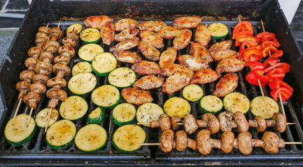 Chicken and vegetables on grill