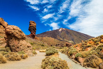 Naklejka premium Roques de Garcia stone and Teide mountain volcano at the sunny morning in the Teide National Park, Tenerife, Canary Islands, Spain.