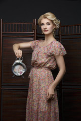 Beautiful girl with vintage clock