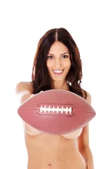 Foto op Plexiglas Beautiful nude woman holding american football ball. © Piotr Marcinski
