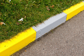 Coloured edge of the road curbs