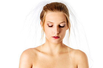 Close-up portrait of a pretty bride with a veil