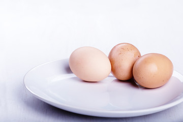 Three raw or boiled chicken eggs