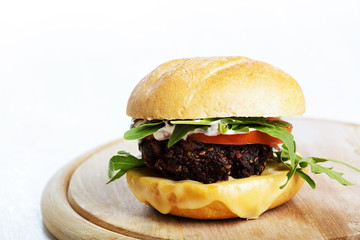 Vegetarian burger with cheese and vegetables