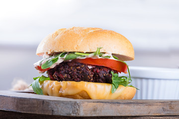 Vegetarian burger with cheese and vegetables
