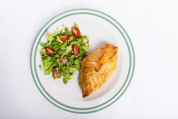 Chicken breast in french pastry with fresh salad