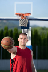 Portrait of young man street basket player