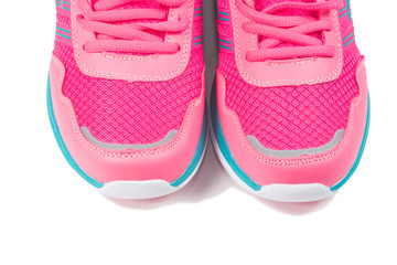 Pink sport shoes on white background
