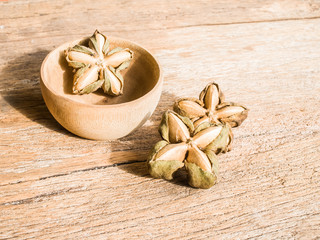 Inca nuts on wood background
