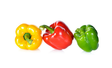 fresh green, red, yellow bell pepper with stem on white backgrou