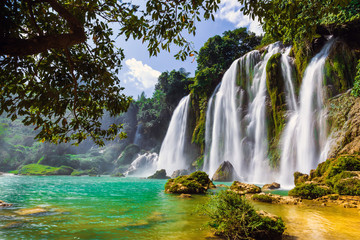 Bangioc waterfall in Caobang, Vietnam - The waterfalls are located in an area of mature karst formations were the original limestone bedrock layers are being eroded.