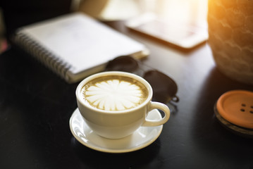 Coffee cup in the coffe shop, soft focus