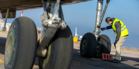 Airport worker checking chassis