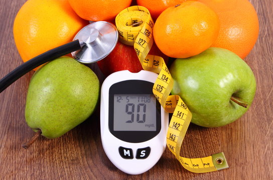 Glucometer with centimeter and fresh fruits, diabetes and healthy nutrition