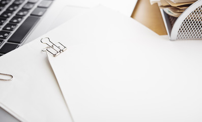 Blank papers. Office desk table with supplies. 