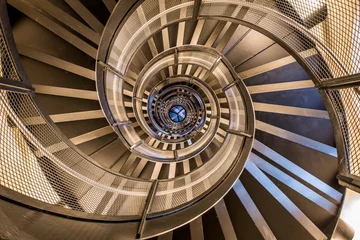 Wall murals Stairs Spiral staircase in tower - interior architecture of building