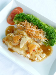 chinese food - deep fried dolly fish with xo sauce in white dish - healthy food
