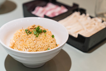 garlic fried rice with vegetables on top