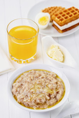 Healthy breakfast, porridge with oat, wheat, barley and rye flakes