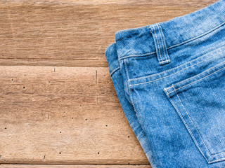 Short jean on wood background
