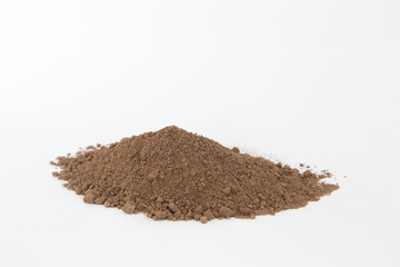 Pile of  brown  soil on white background