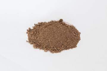 Pile of  brown  soil on white background