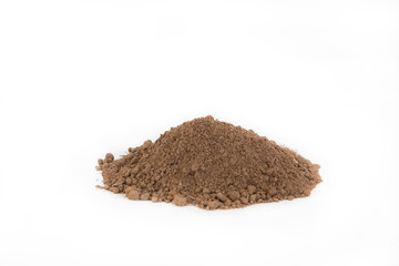 Pile of  brown  soil on white background