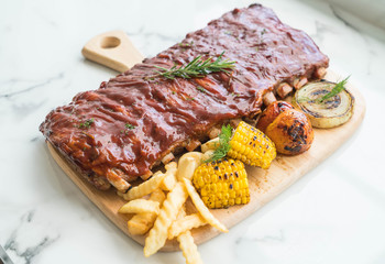Grilled rib pork with barbecue sauce and vegetable and frech fri