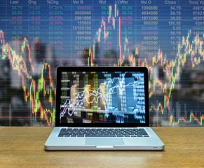 Stock exchange market trading graph over the screen of computer
