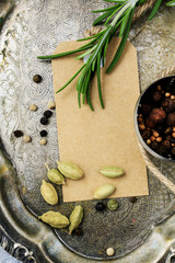 Rosemary (Rosmarinus officinalis) twig and vintage paper card